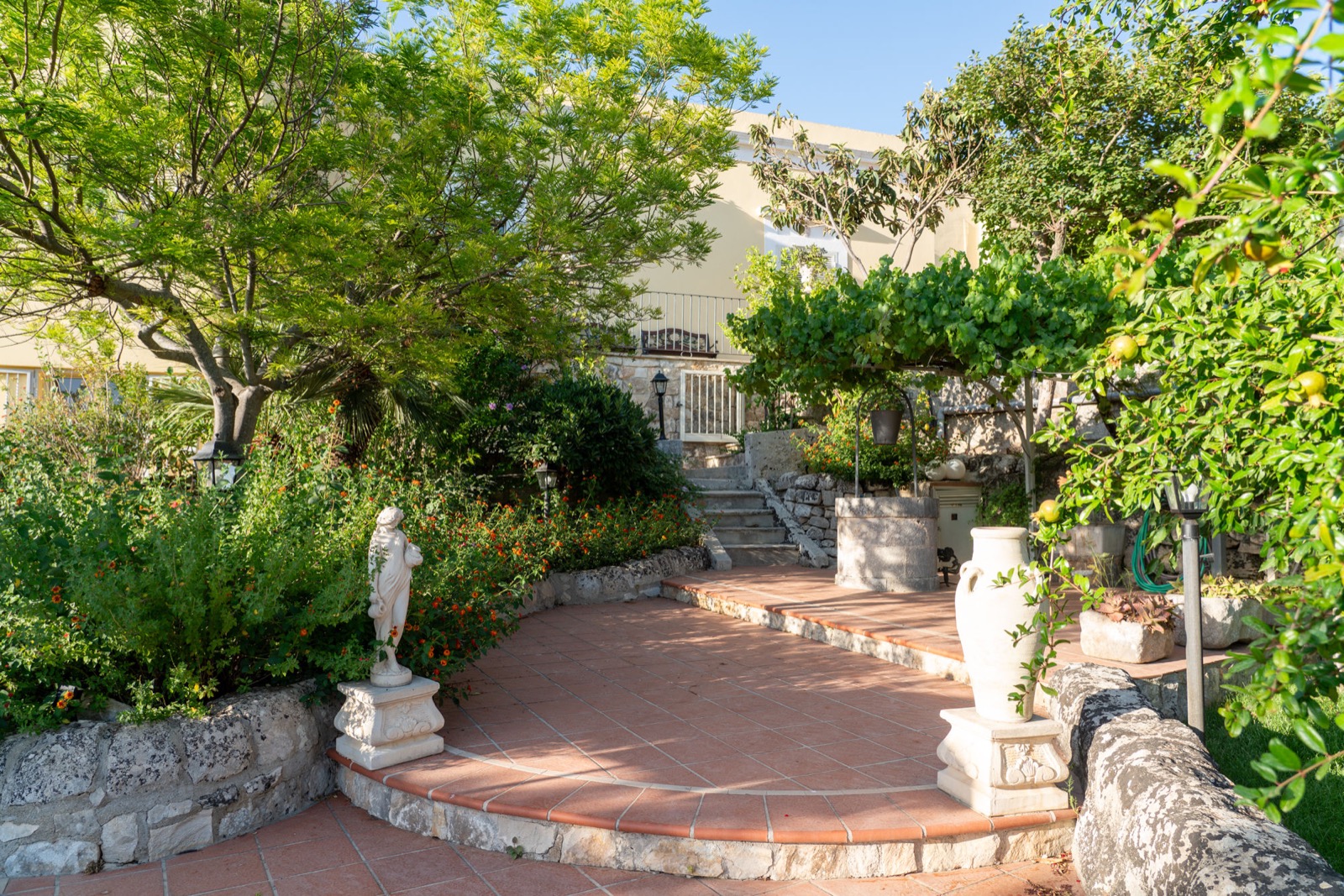 The garden and stone terraces of Villa Modica